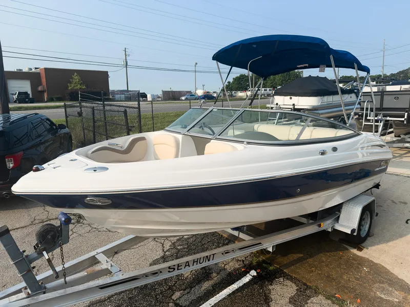 Slide: The Image of 2007 Chaparral 190 SSi boat on trailer with blue canopy in outdoor setting. - 3