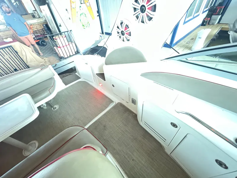 Slide: The Image of Interior of a 2001 Sea Ray 340 Sundancer boat with seating and storage compartments. - 10