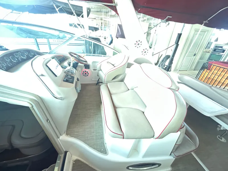 Slide: The Image of 2001 Sea Ray 340 Sundancer cockpit with dual seating and control panel. - 15