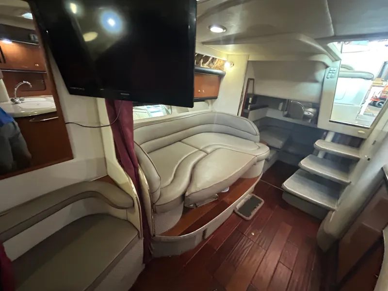 Slide: The Image of Interior of 2001 Sea Ray 340 Sundancer yacht with plush seating and modern amenities. - 19