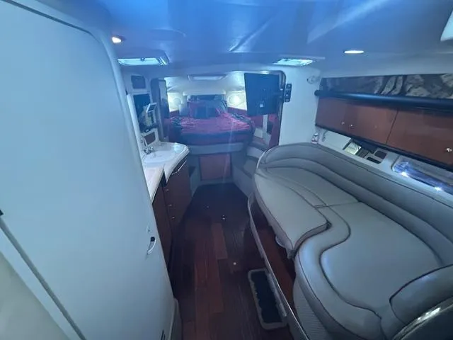 Slide: The Image of Interior of 2001 Sea Ray 340 Sundancer yacht with seating and sleeping area. - 20