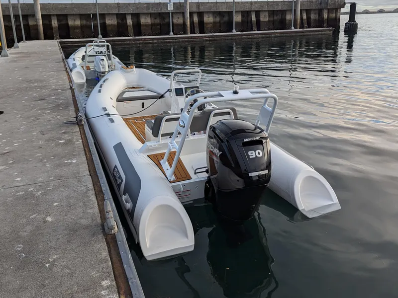 Slide: The Image of Tide Craft Kodiak 16 boat on sandy shore, 2026 model, with calm water backdrop. - 5
