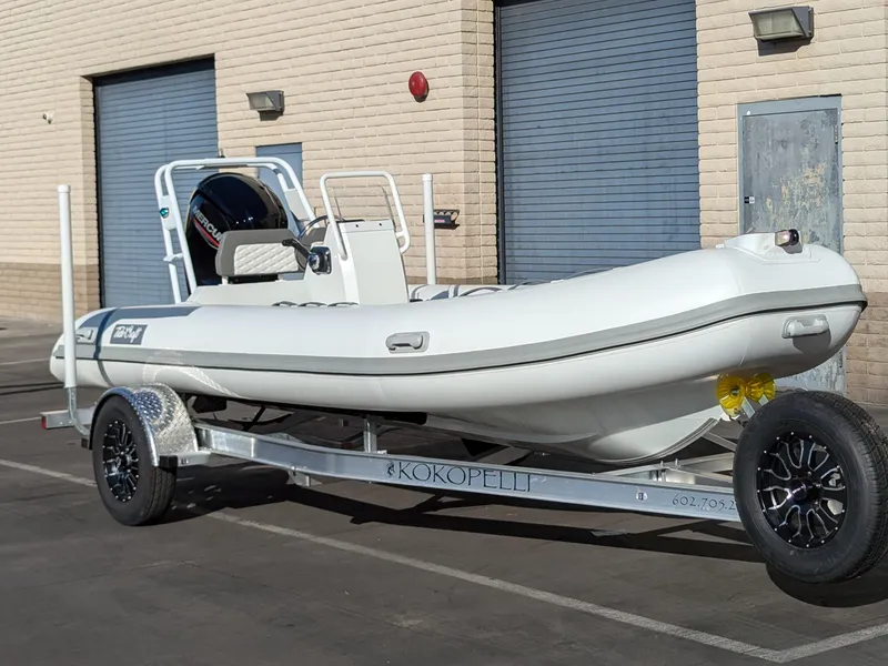 Slide: The Image of 2025 Tide Craft Kodiak 16 boat, aerial view, showcasing sleek design and wooden deck. - 8