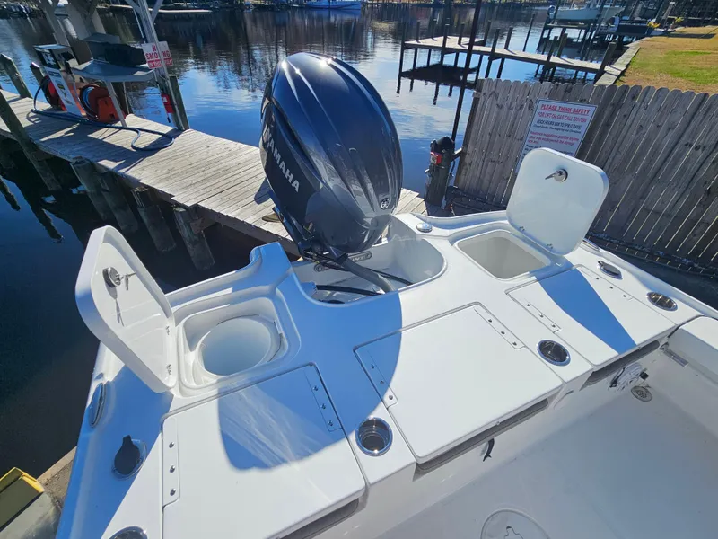 Slide: The Image of 2026 Sea Hunt BX 22 BR boat with Yamaha outboard motor at dock. - 11