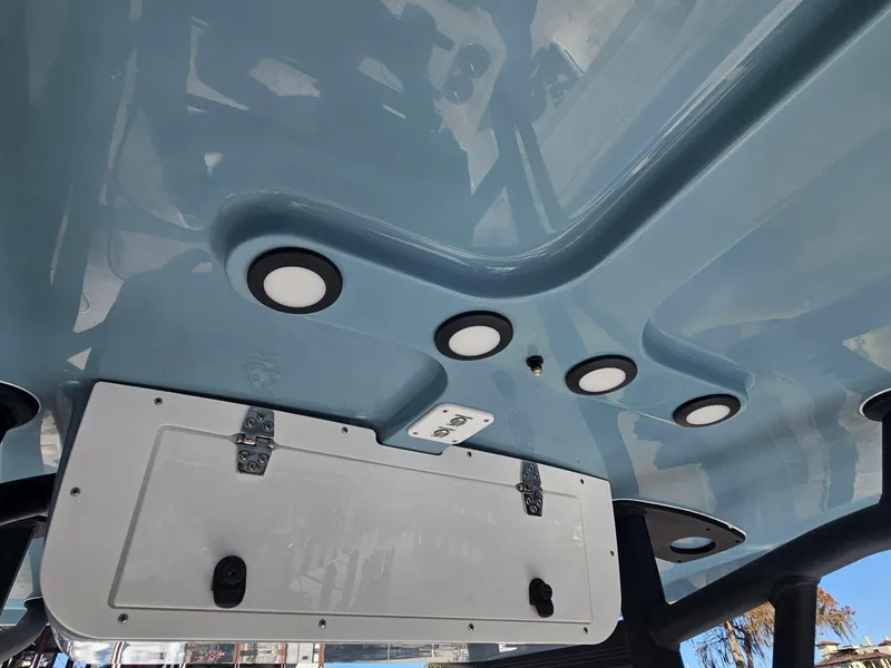 Slide: The Image of 2026 Sea Hunt BX 22 BR boat underside with recessed lighting and storage compartment. - 15