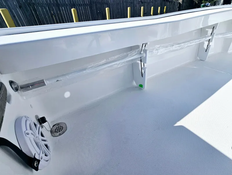 Slide: The Image of 2026 Sea Hunt BX 22 BR boat interior with white deck and storage compartments. - 20