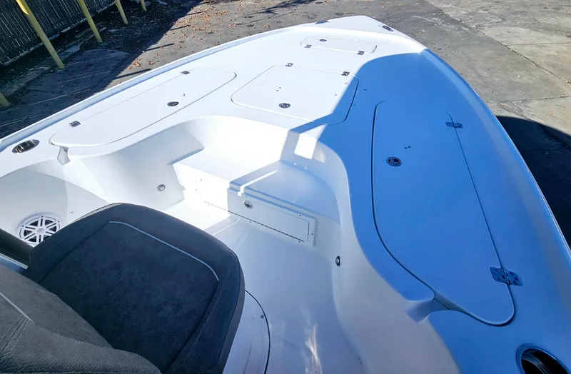 Slide: The Image of 2026 Sea Hunt BX 22 BR boat interior, featuring spacious seating and storage compartments. - 22