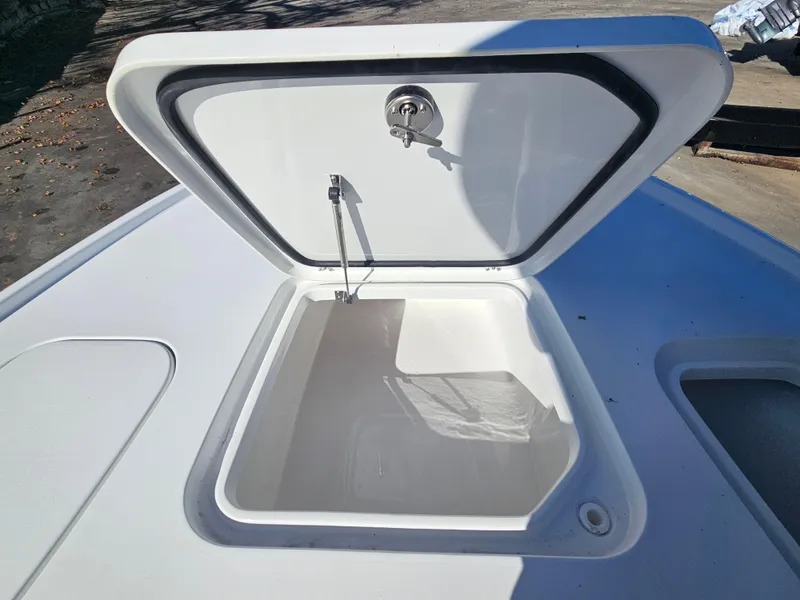 Slide: The Image of Open storage compartment on 2026 Sea Hunt BX 22 BR boat deck. - 24