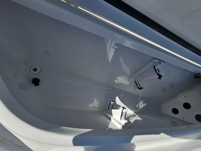 Slide: The Image of 2026 Sea Hunt BX 22 BR boat storage compartment, featuring a sleek, white interior design. - 25