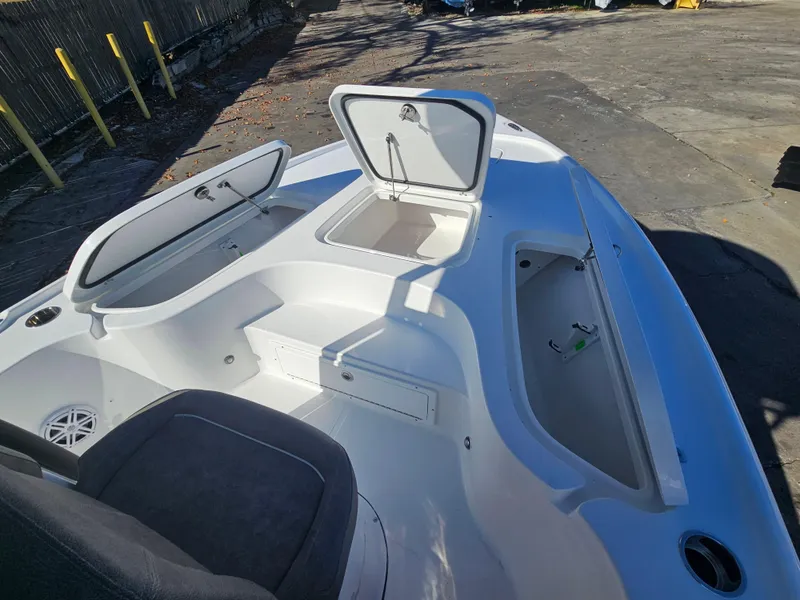 Slide: The Image of 2026 Sea Hunt BX 22 BR boat interior with open storage compartments. - 26