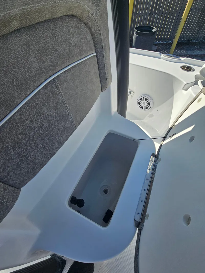Slide: The Image of 2026 Sea Hunt BX 22 BR boat interior with storage compartment and seating. - 28