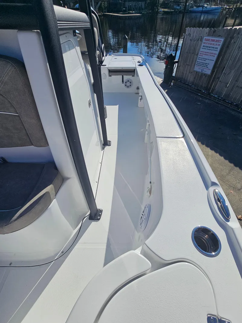 Slide: The Image of 2026 Sea Hunt BX 22 BR boat interior, featuring sleek white design and modern seating. - 32