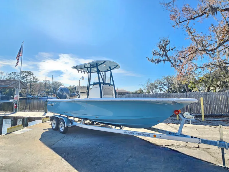 Slide: The Image of 2026 Sea Hunt BX 22 BR boat on trailer, parked outdoors under clear sky. - 4