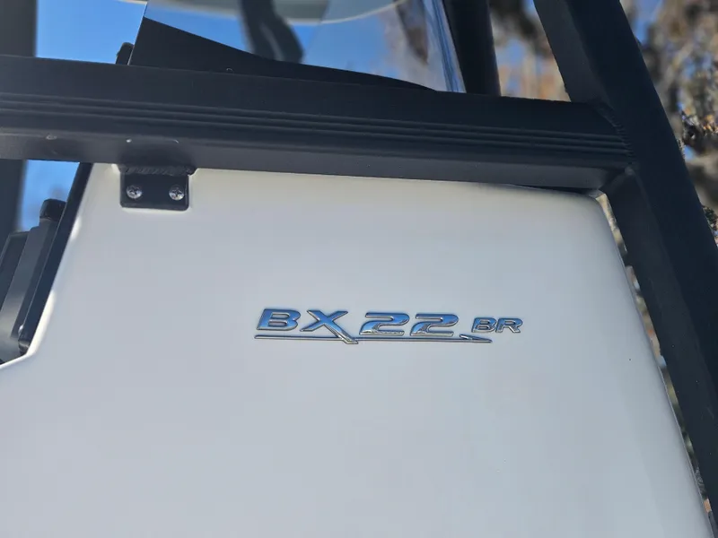 Slide: The Image of 2026 Sea Hunt BX 22 BR boat emblem on white surface. - 7