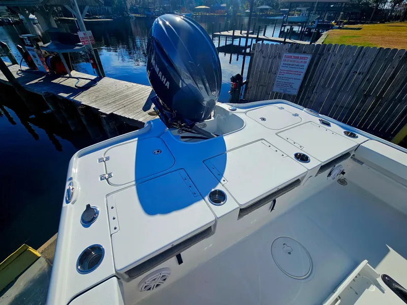 Slide: The Image of 2026 Sea Hunt BX 22 BR boat with Yamaha outboard engine at dock. - 8