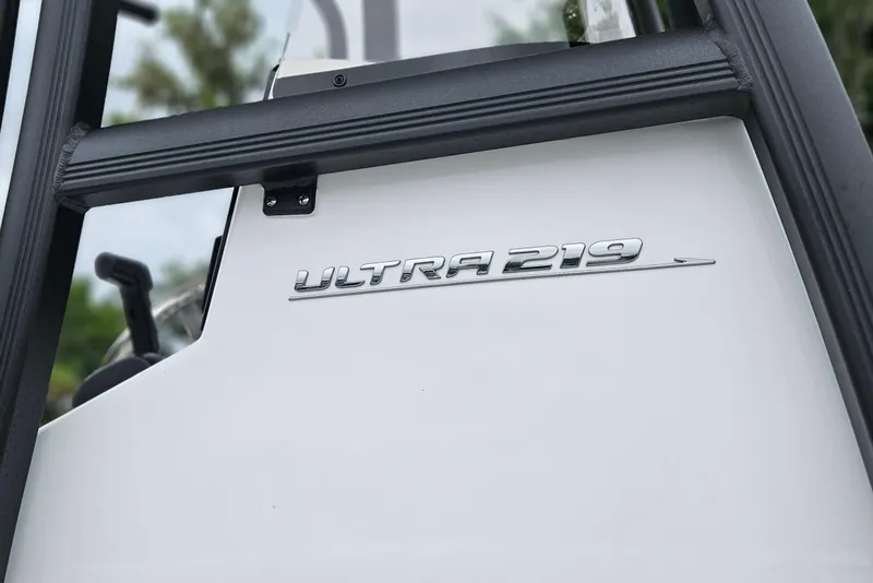 Slide: The Image of 2026 Sea Hunt Ultra 219 boat logo on white surface, close-up view. - 11
