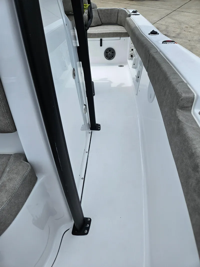 Slide: The Image of 2025 Sea Hunt Ultra 219 boat interior with cushioned seating and sleek design. - 19