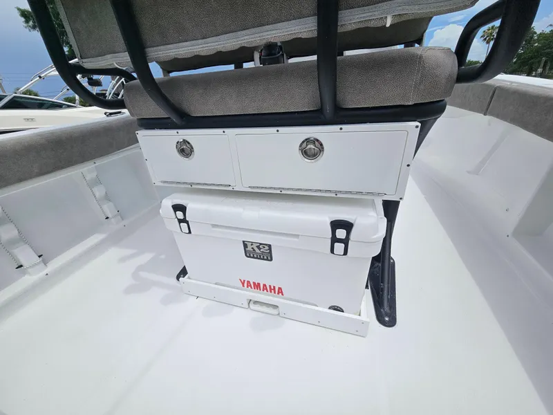 Slide: The Image of 2025 Sea Hunt Ultra 219 boat interior with Yamaha cooler and storage compartments. - 8