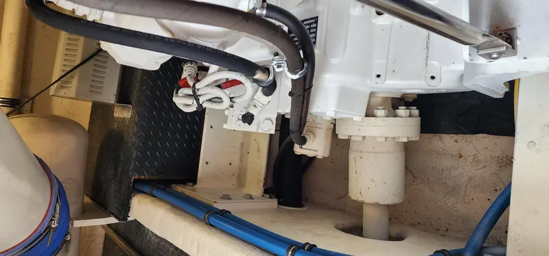 Slide: The Image of Engine room of 2004 Silverton 48 Convertible yacht, showing mechanical components and piping. - 18