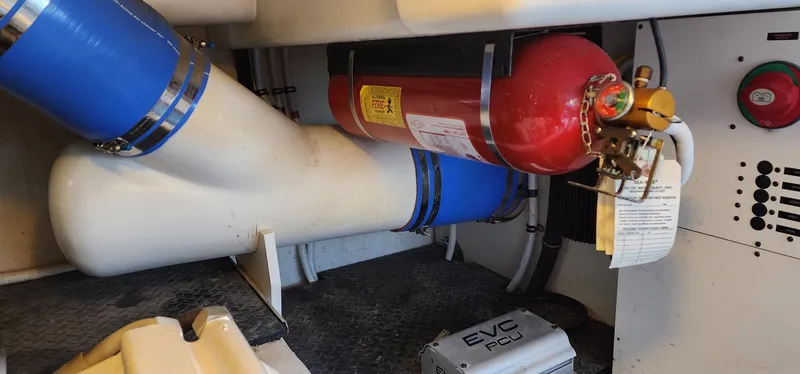 Slide: The Image of Engine room of 2004 Silverton 48 Convertible with fire extinguisher and piping system. - 20