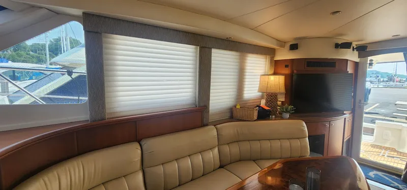 Slide: The Image of Luxurious interior of 2004 Silverton 48 Convertible yacht with leather seating and elegant decor. - 4
