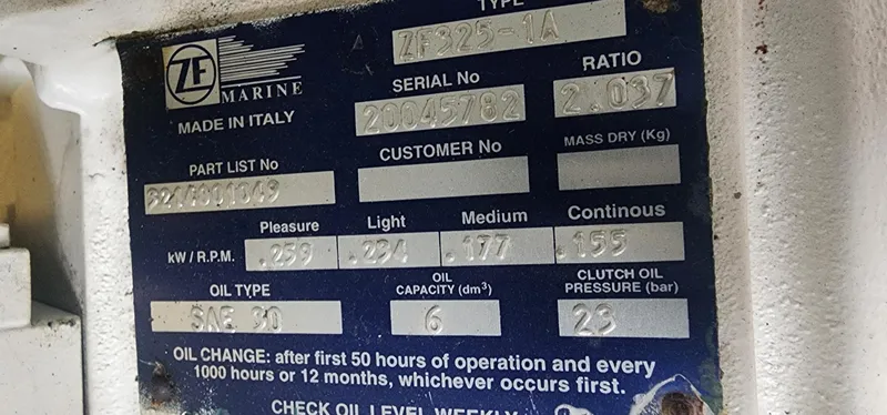 Slide: The Image of Label on ZF Marine engine, detailing specifications and oil change instructions. - 42
