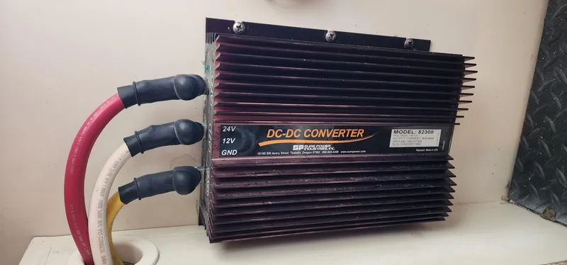 Slide: The Image of DC-DC converter with cables in a 2004 Silverton 48 Convertible boat. - 43