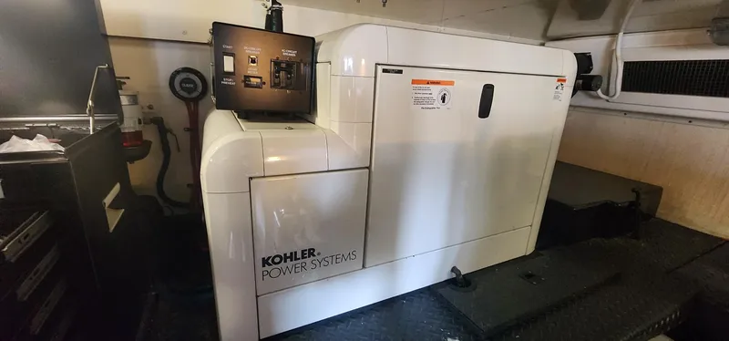 Slide: The Image of Kohler power system in 2004 Silverton 48 Convertible yacht engine room. - 48