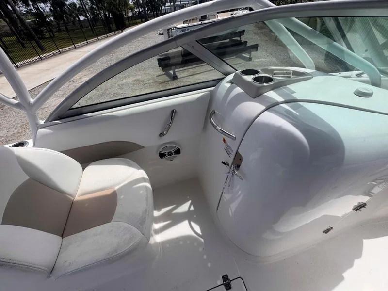 Slide: The Image of 2019 Robalo R227 Dual Console interior with seating and cup holders. - 17