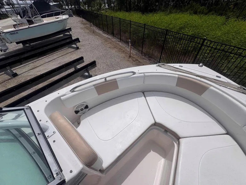 Slide: The Image of 2019 Robalo R227 Dual Console boat with spacious seating and sleek design. - 21