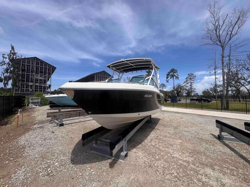 Slide: The Image of 2019 Robalo R227 Dual Console boat on display under a clear blue sky. - 5