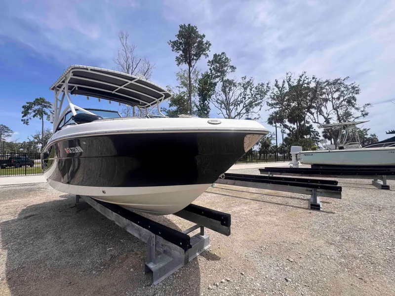 Slide: The Image of 2019 Robalo R227 Dual Console boat on display, parked on a trailer. - 6