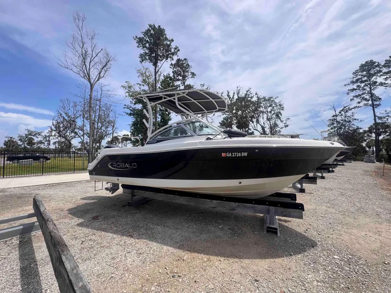 Slide: The Image of 2019 Robalo R227 Dual Console boat on display in outdoor setting. - 7