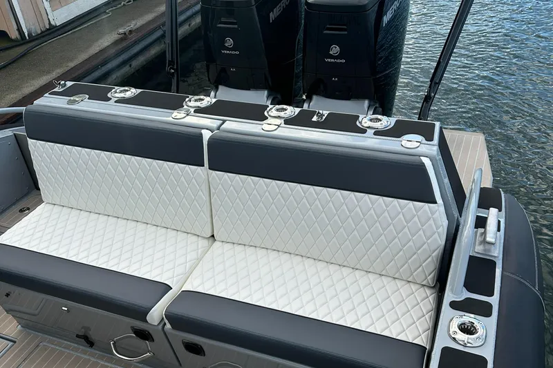 Slide: The Image of Luxury seating on 2023 Life Proof 35 Full Cabin boat, featuring quilted upholstery and dual engines. - 11