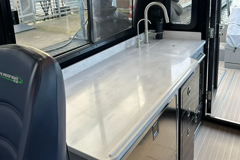 Slide: The Image of Interior of 2023 Life Proof 35 Full Cabin boat with sleek countertop and modern sink. - 12