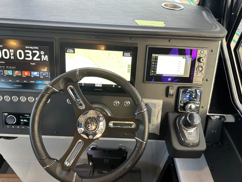 Slide: The Image of 2023 Life Proof 35 Full Cabin dashboard with steering wheel and navigation screens. - 5