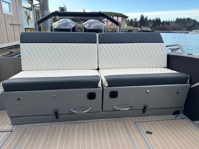 Slide: The Image of 2023 Life Proof 35 Full Cabin boat with cushioned seating and storage compartments. - 7