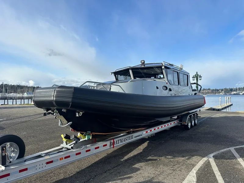 Slide: The Image of 2023 Life Proof 35 Full Cabin boat on trailer by waterfront. - 9