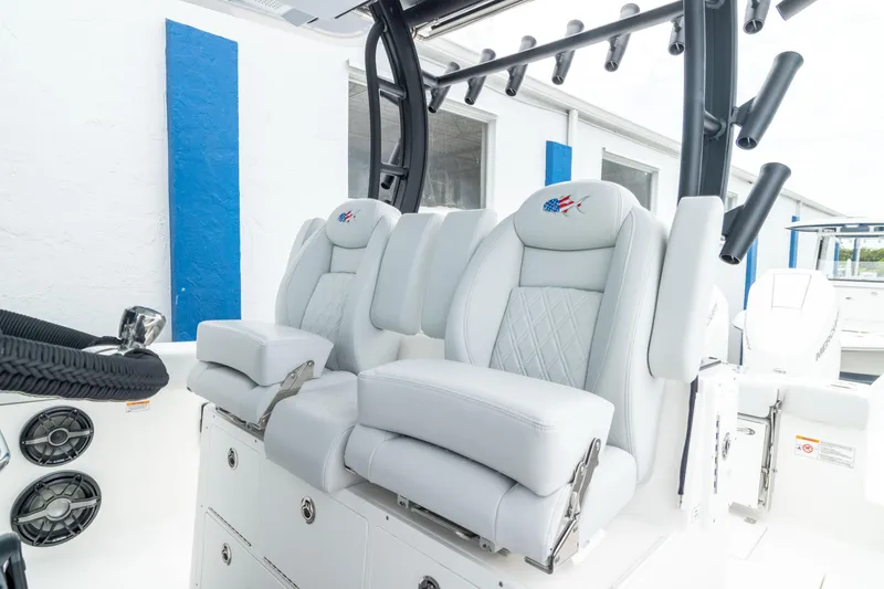Slide: The Image of 2026 Crevalle 33 CSF boat interior with luxurious white seating and modern design. - 2