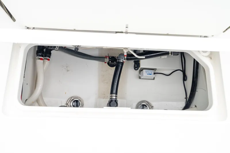 Slide: The Image of Bilge area of 2026 Crevalle 33 CSF boat, showing hoses and wiring. - 23