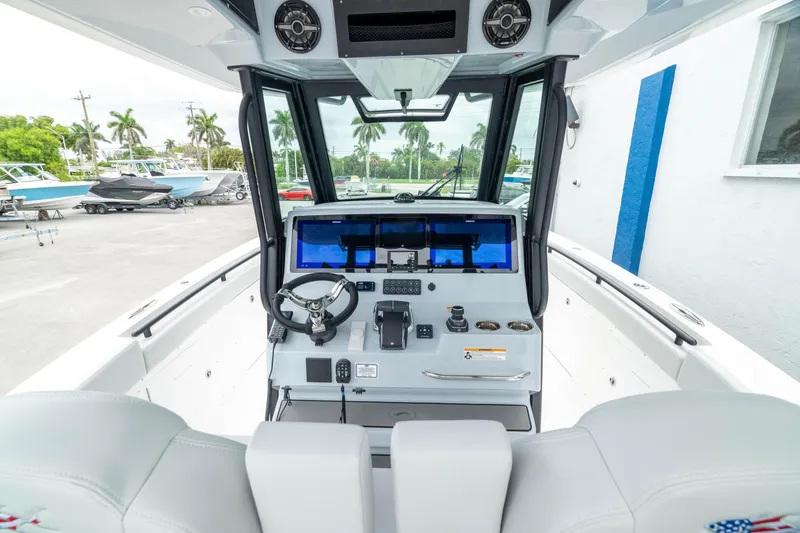 Slide: The Image of 2026 Crevalle 33 CSF boat cockpit with modern controls and dual seating. - 30