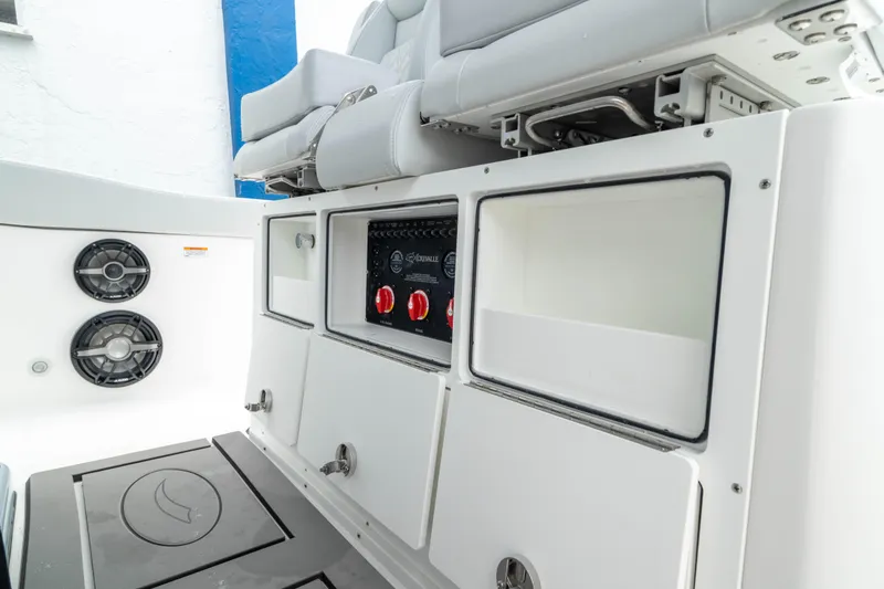 Slide: The Image of 2026 Crevalle 33 CSF boat interior with control panel and storage compartments. - 35