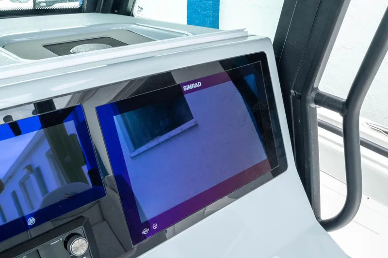 Slide: The Image of 2026 Crevalle 33 CSF boat dashboard with modern navigation display. - 38