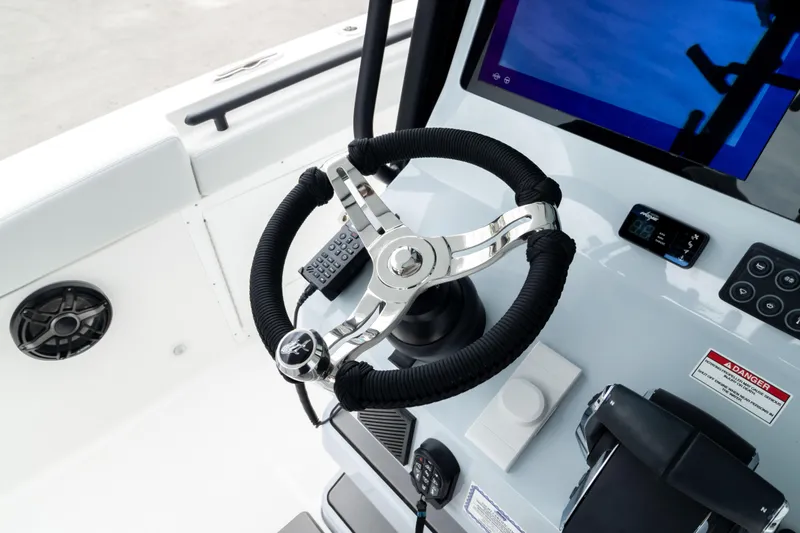 Slide: The Image of Steering wheel and controls of 2026 Crevalle 33 CSF boat cockpit. - 45