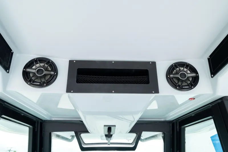 Slide: The Image of 2026 Crevalle 33 CSF boat interior with speakers and ventilation system. - 49