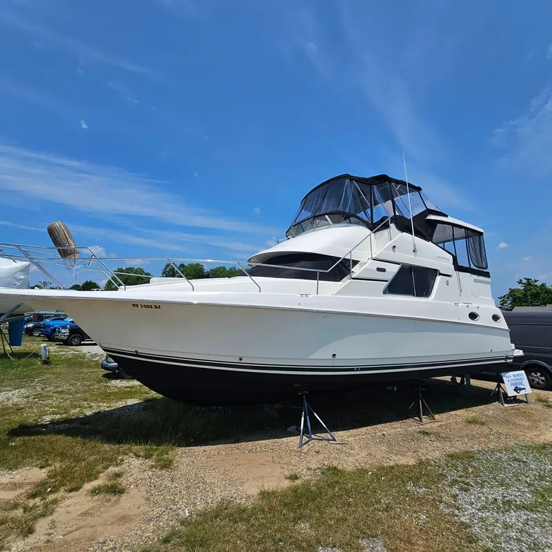 The Image of 2000 Silverton 392 Motor Yacht on display under a clear blue sky. - 0