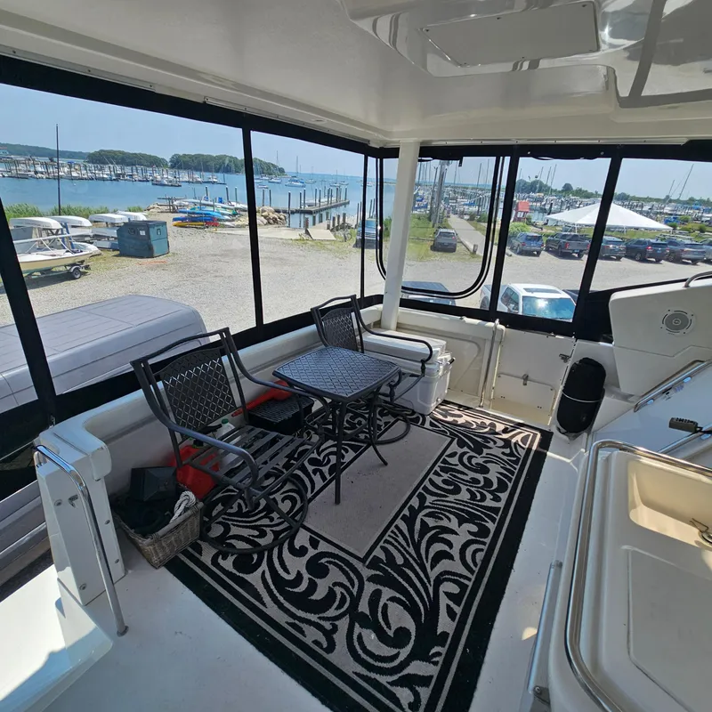 Slide: The Image of Interior of 2000 Silverton 392 Motor Yacht with seating and marina view. - 11