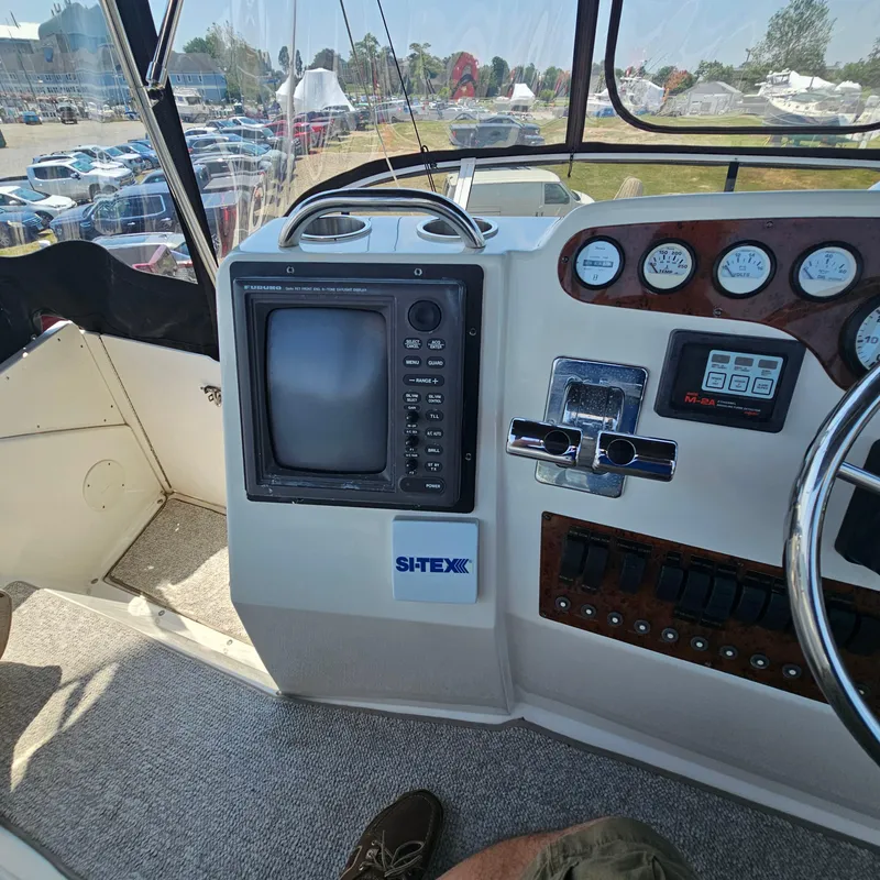 Slide: The Image of Control panel of a 2000 Silverton 392 Motor Yacht with navigation equipment. - 15