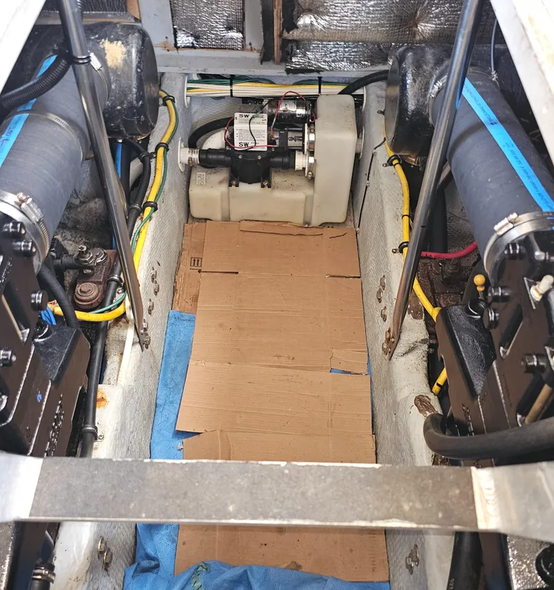 Slide: The Image of Engine compartment of a 2000 Silverton 392 Motor Yacht with visible components and wiring. - 35