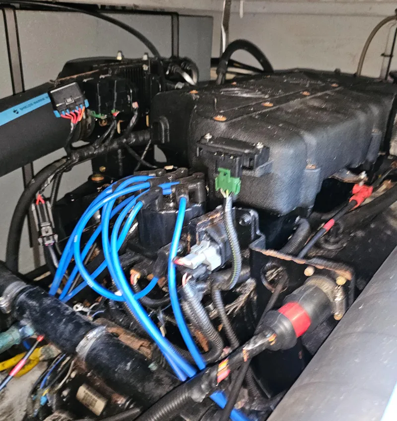 Slide: The Image of Engine compartment of a 2000 Silverton 392 Motor Yacht with visible wiring and components. - 36